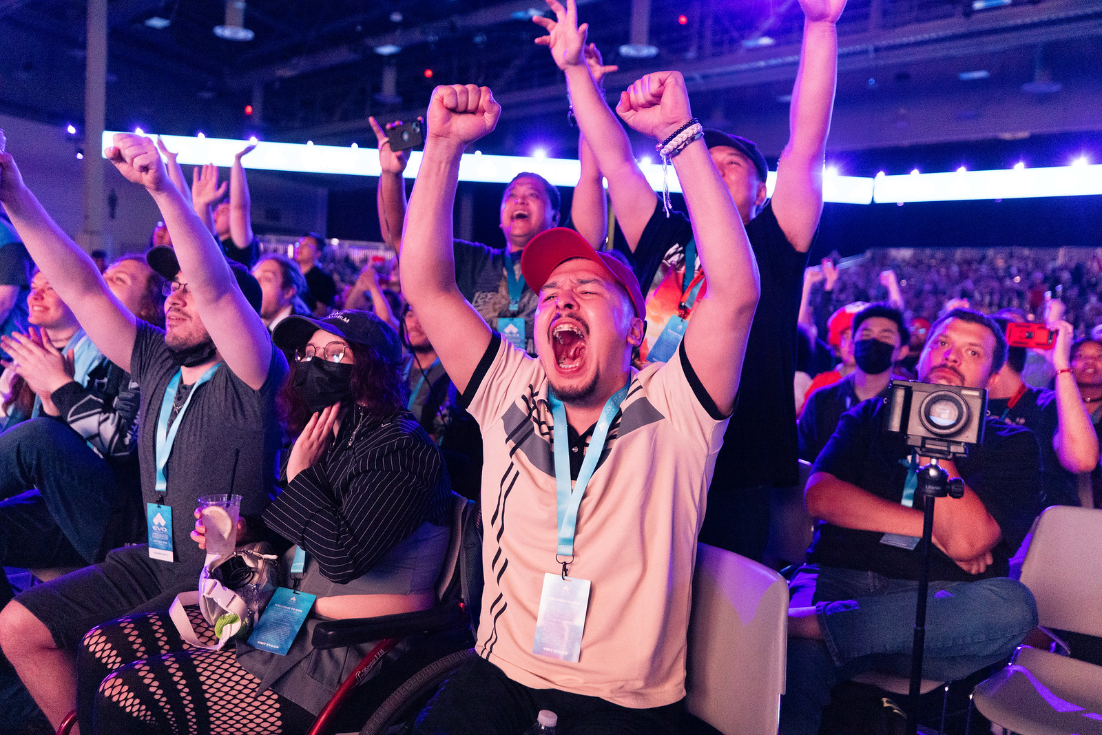 Fans cheer during a live esports match.