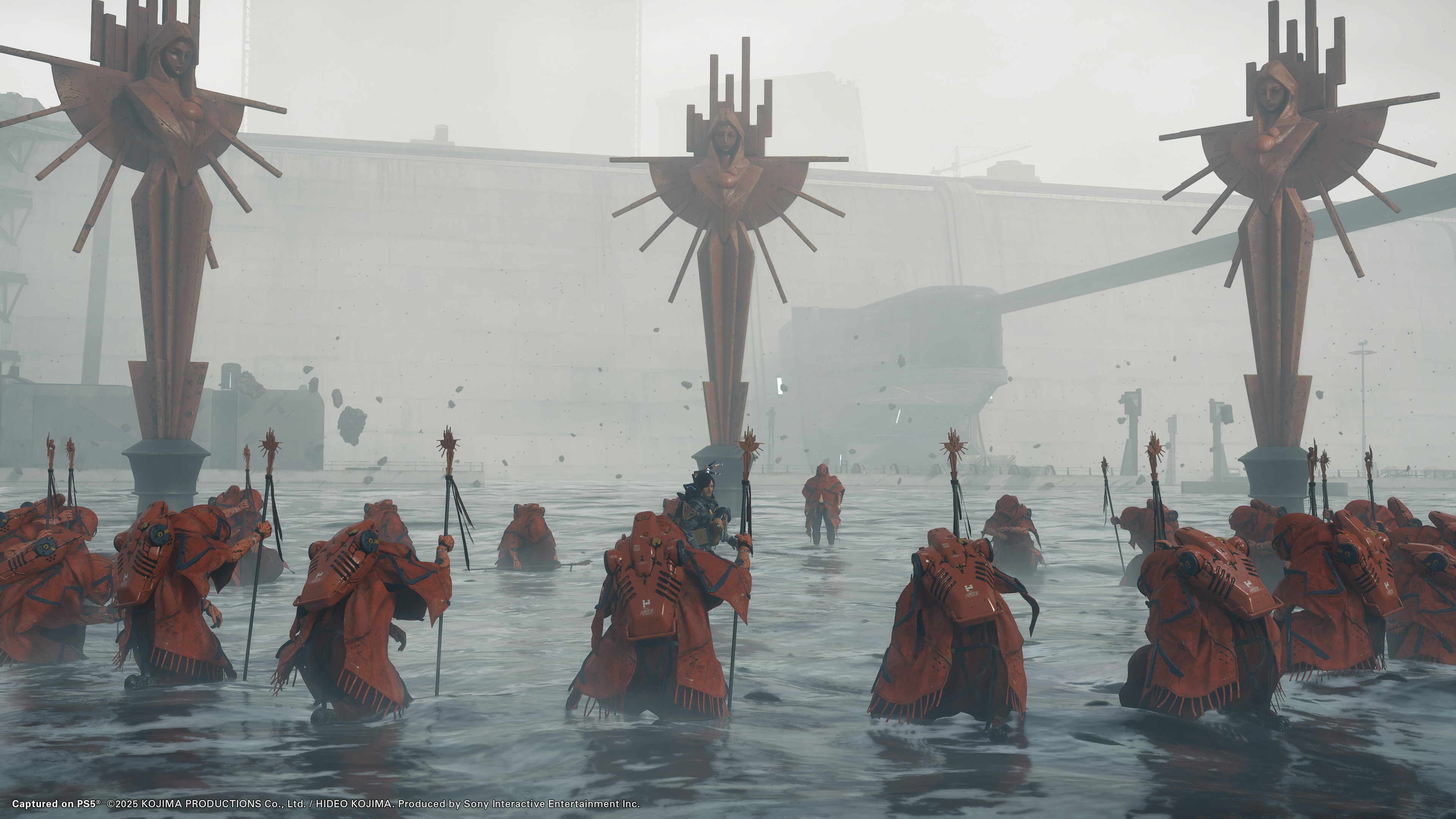 Death Stranding 2: On the Beach screenshot showing red-suited enemies surrounding Sam