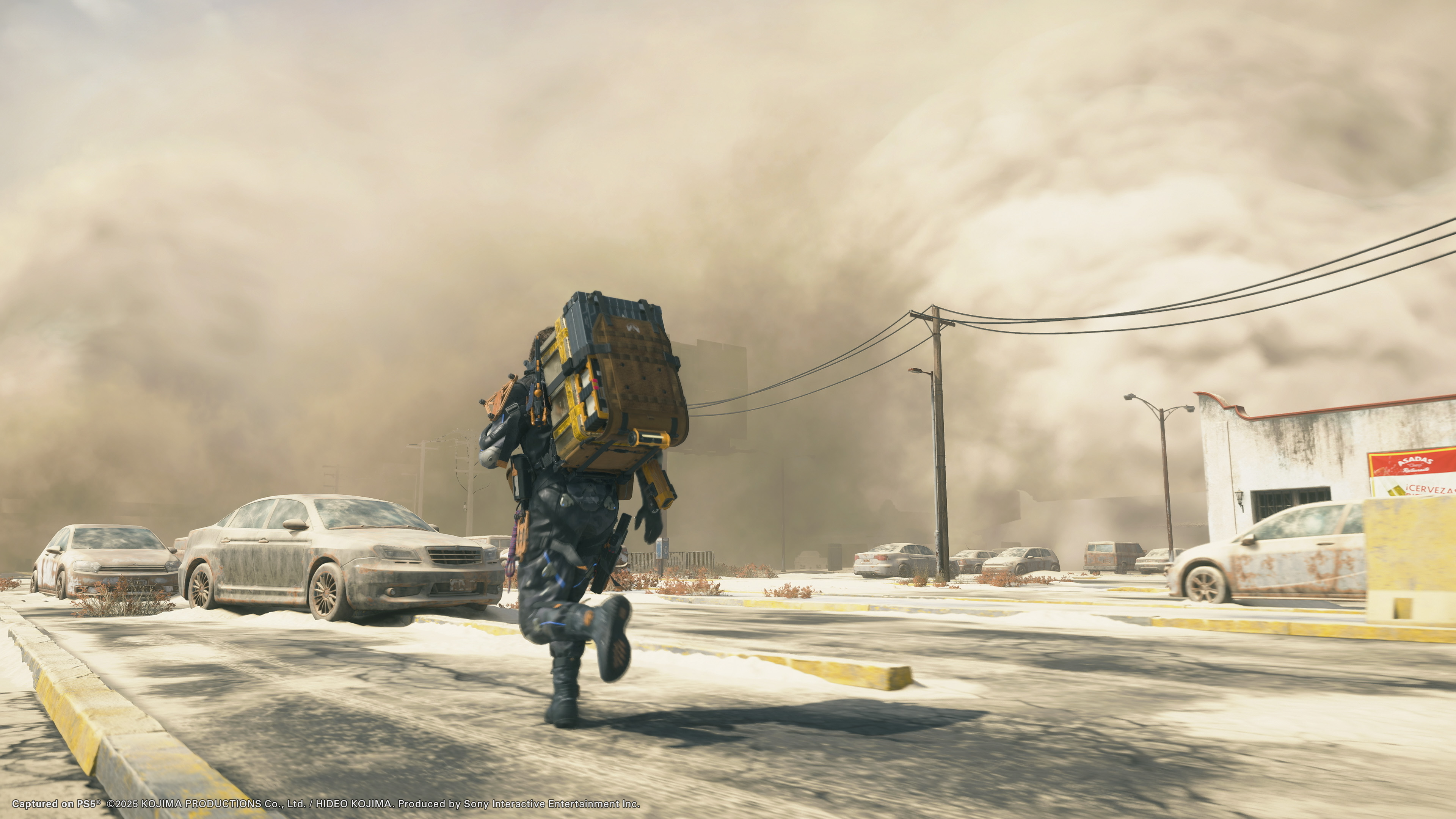 Death Stranding 2: On the Beach screenshot showing Sam running during a sandstorm