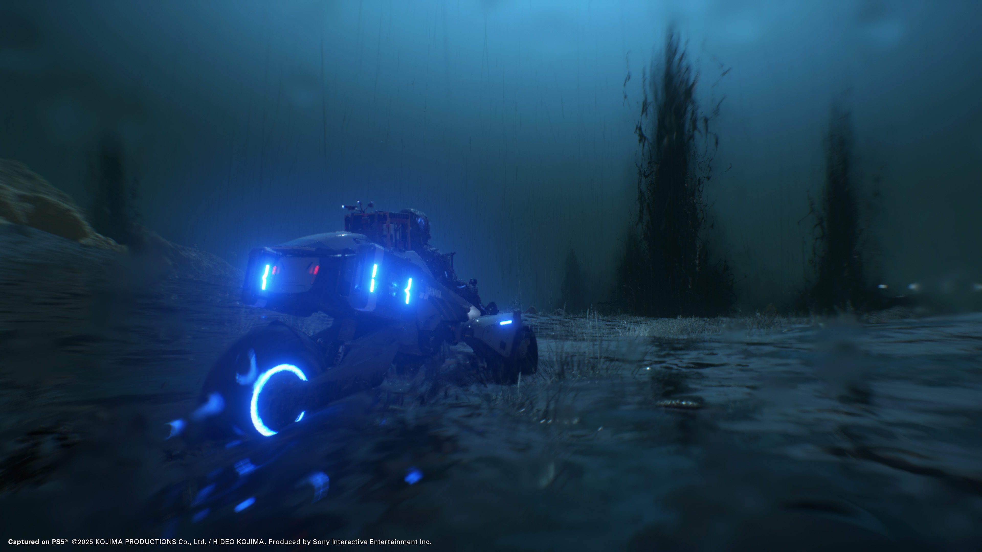 Death Stranding 2: On the Beach screenshot showing Sam using a bike-like vehicle in a tarry environment