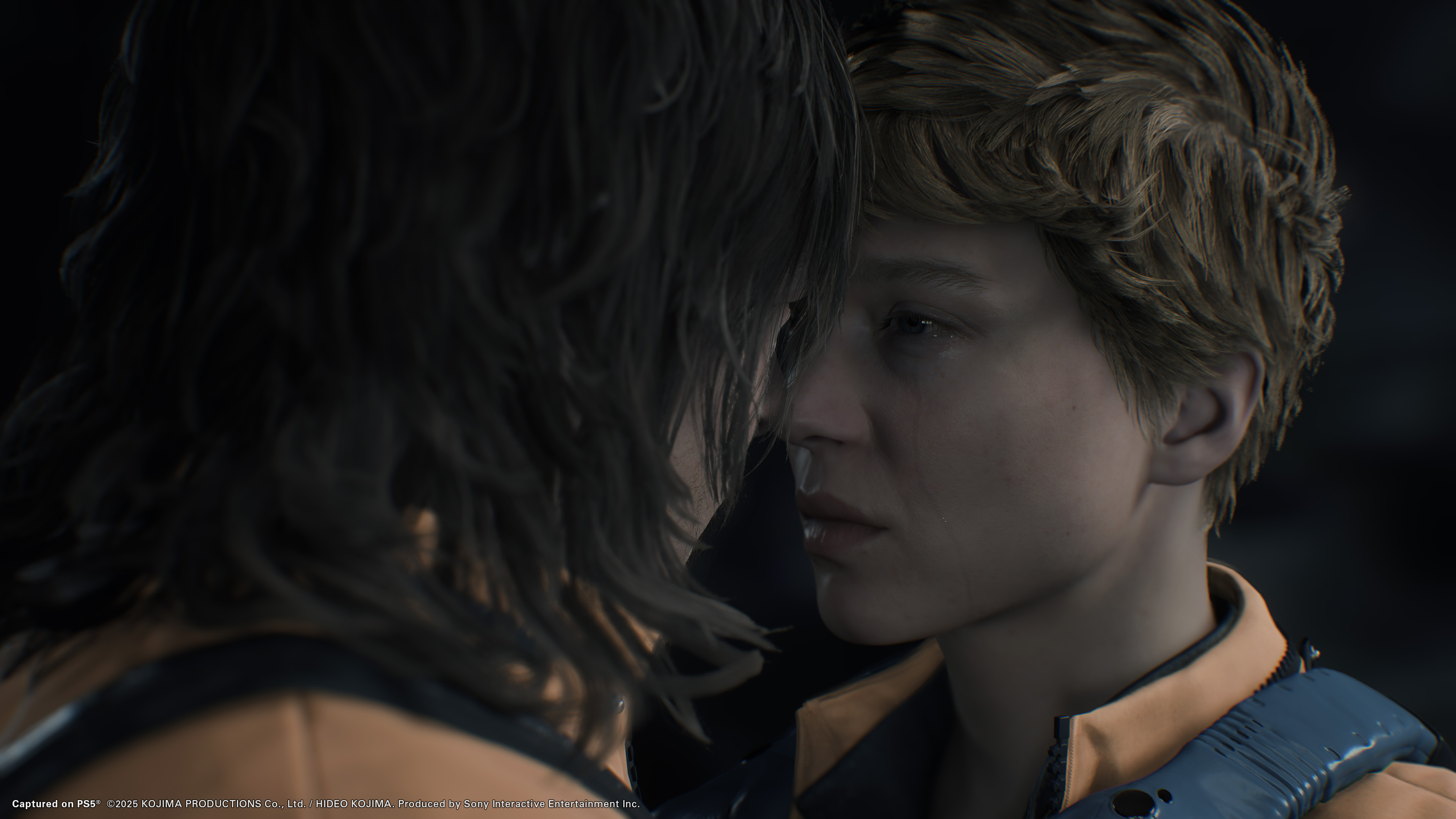 Death Stranding 2: On the Beach screenshot showing Sam and Fragile about to kiss